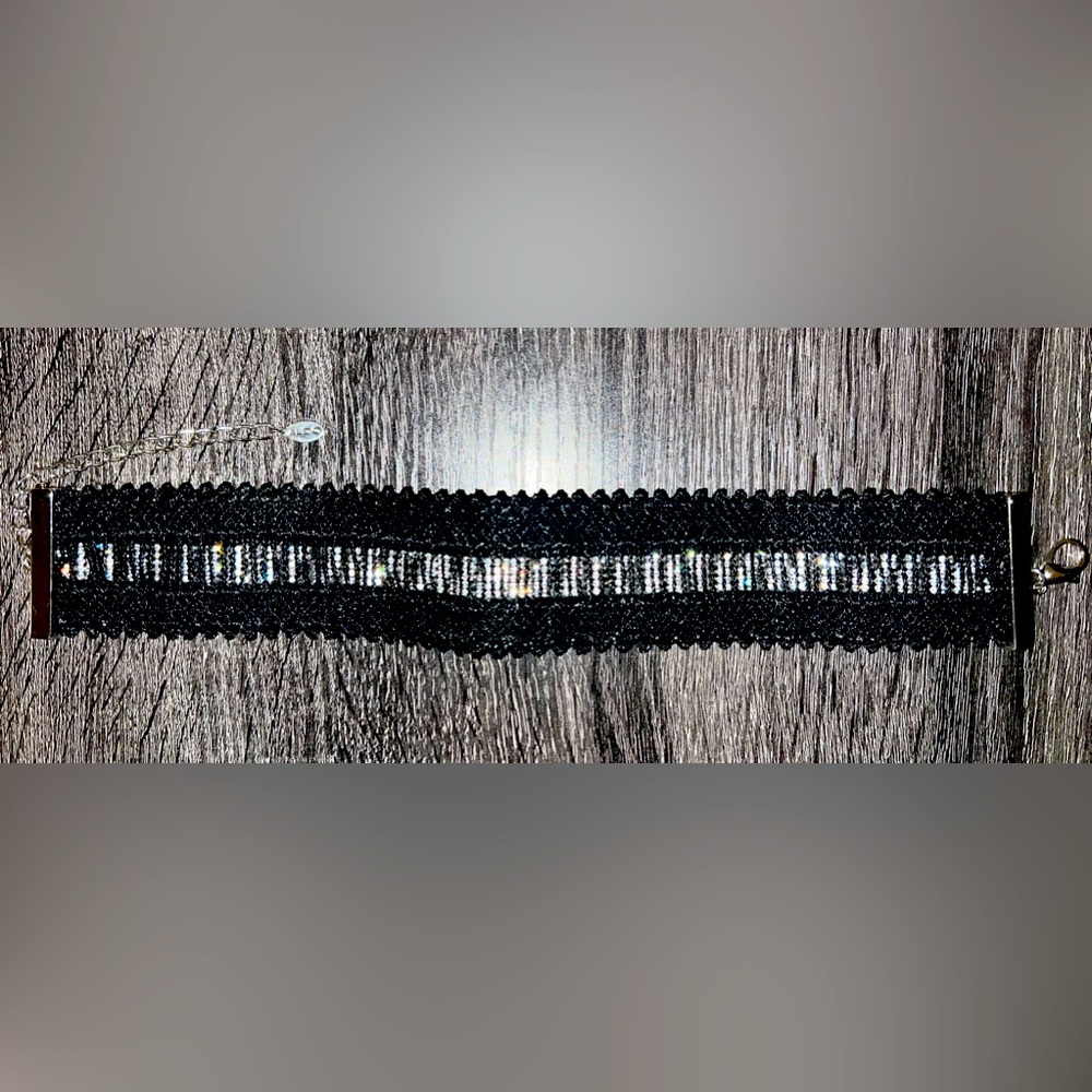 Aldo’s black embroidered and crystal choker
